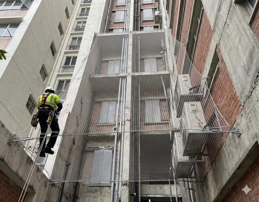 Duct area net fitted across a building utility duct to stop pigeons entering