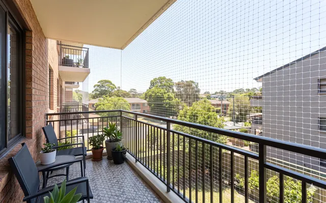 Balcony safety net installed to keep pigeons out of an apartment balcony