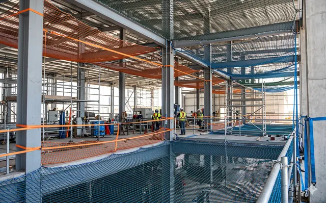 Industrial bird netting installed in a warehouse roof space